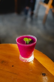 A vibrant image of a healthy natural smoothie with fresh fruits and herbs.