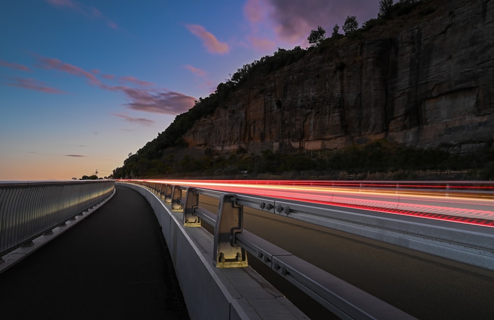 a long exposure shot of a highway at night