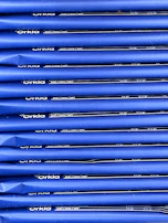 Neatly arranged rows of wholesale products in grey and navy packaging, highlighting the variety available for bulk purchase.