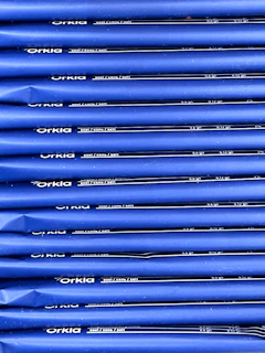 Close-up of rat bait blocks (sebos) arranged neatly with a subtle blue and white branded packaging