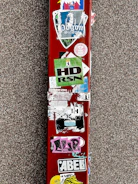 Close-up of colorful custom vinyl decals on various surfaces.