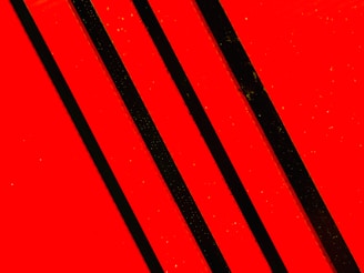 A bold, sharp esports logo design with red and black colors.