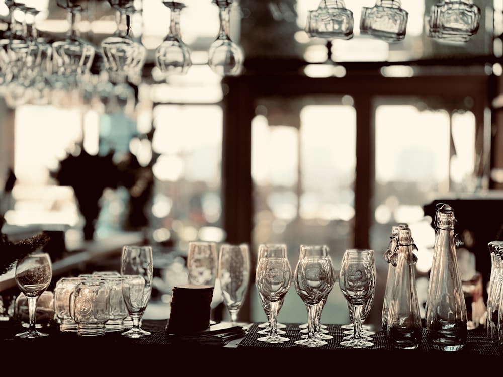 a table topped with lots of empty wine glasses