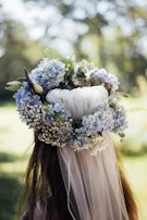 A charming flower crown made with wildflowers and small balloons.