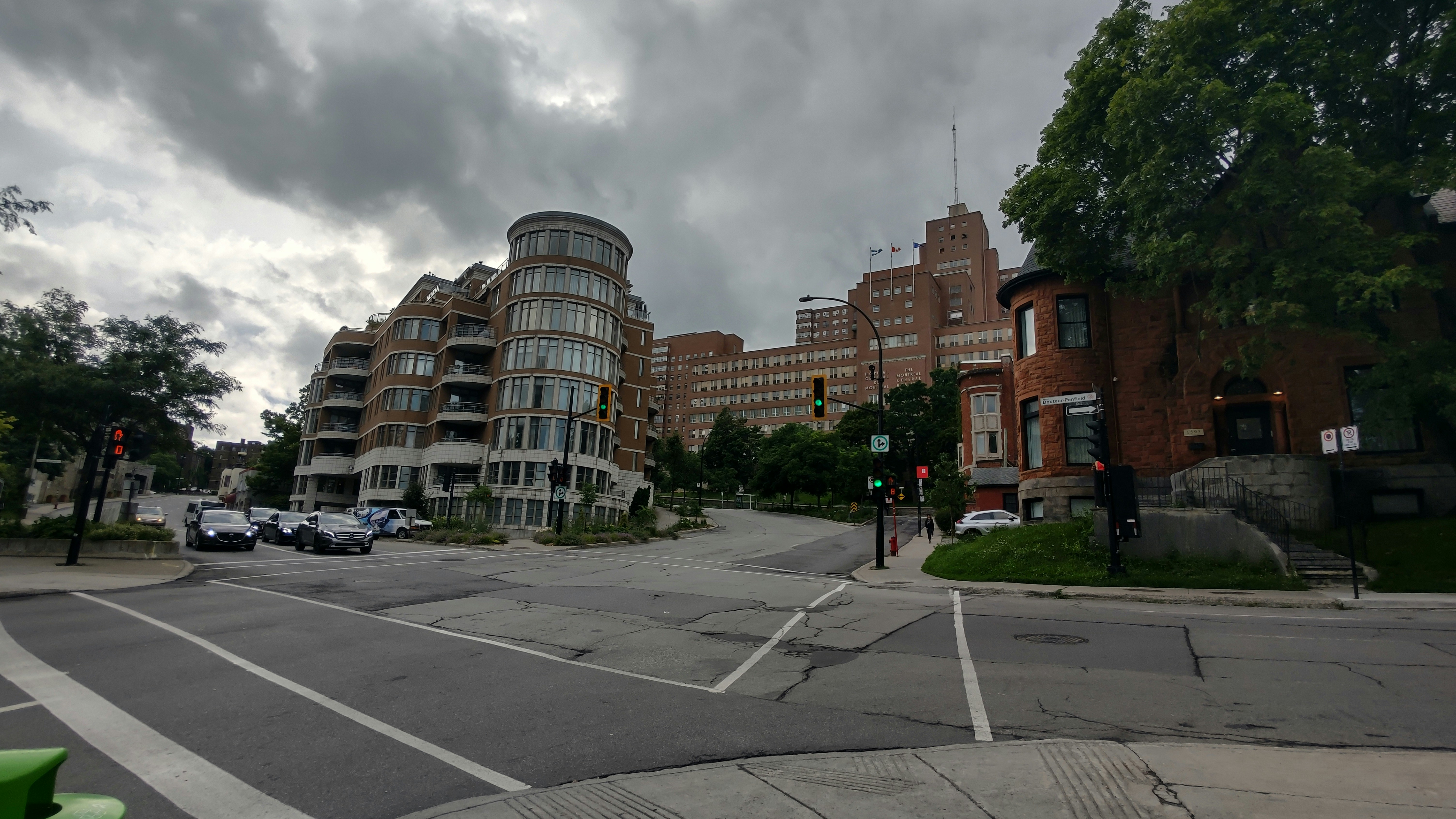 a city street with buildings and a traffic light
