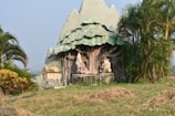 An intricate 3D character model in a natural setting.