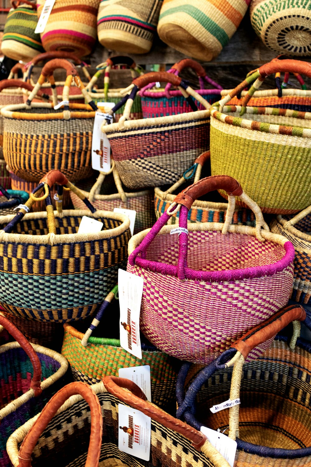 baskets for sale at a market with price tags