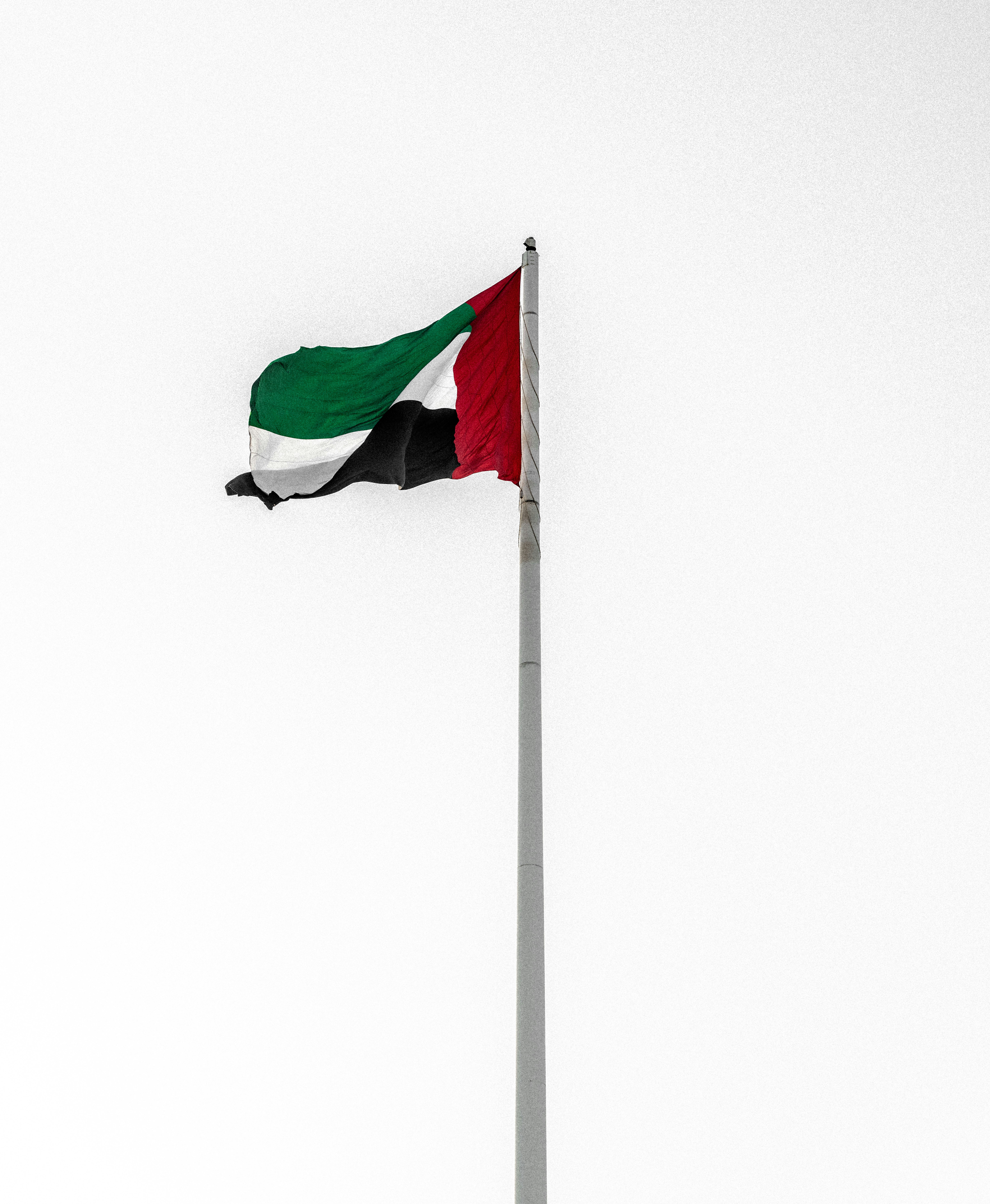 a flag flying on top of a flag pole