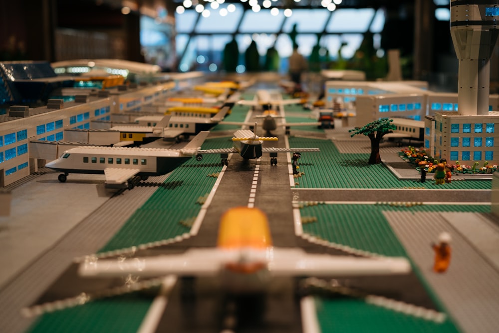 a model of an airport with a plane on the runway