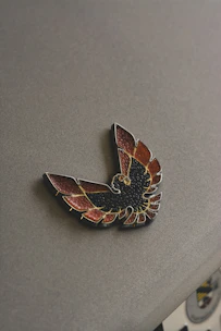 Close-up of a security badge featuring black, white, and silver colors, symbolizing trust and compliance.