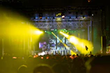 Fans gathered around Dash Caine 040 during an outdoor hip hop event