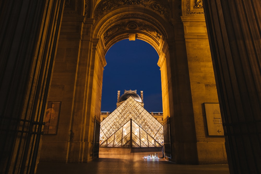 a very tall building with a very tall glass pyramid