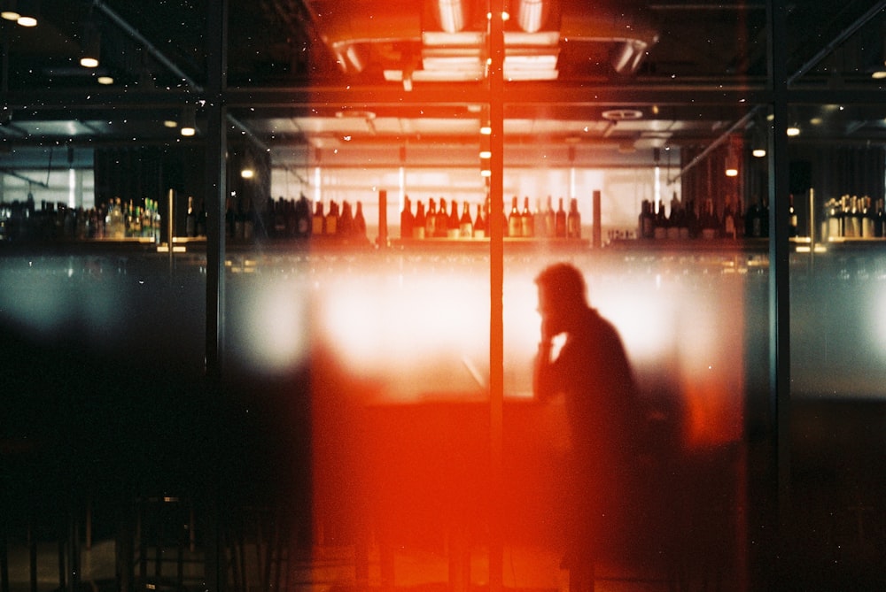 a blurry photo of a person sitting at a table