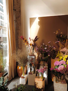 Fresh natural flowers arranged beautifully in a sunlit room.