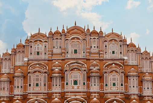 a very tall building with many windows and arches