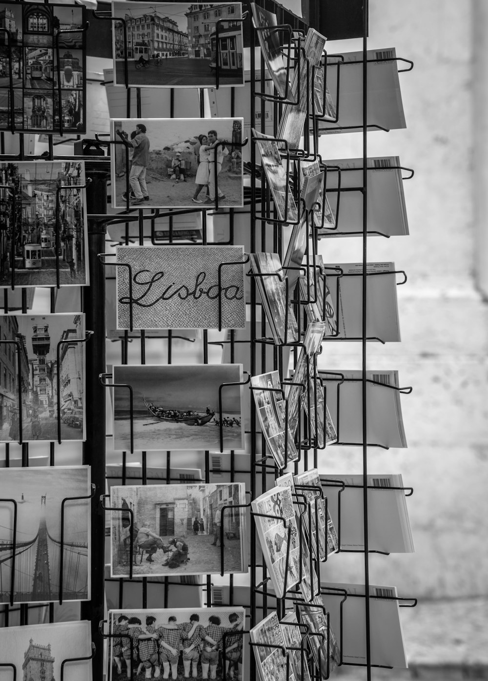 a black and white photo of a magazine rack