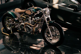 Vibrant custom-painted Harley tins gleaming under workshop lights