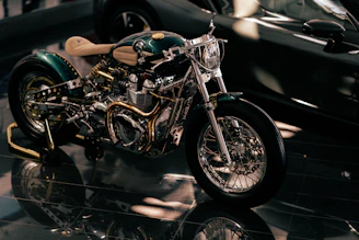 Custom 3D printed motorcycle parts displayed on a workbench with tools.