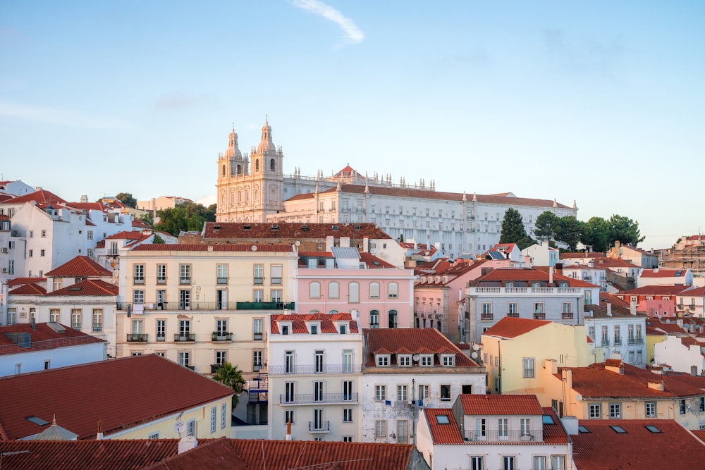 a view of a city with a church steeple in the background