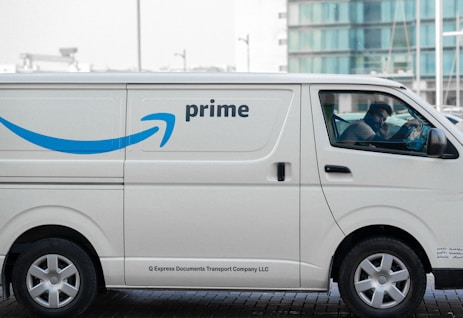 a white van with the amazon prime logo on it