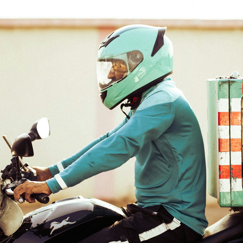 a person riding a motorcycle with a helmet on