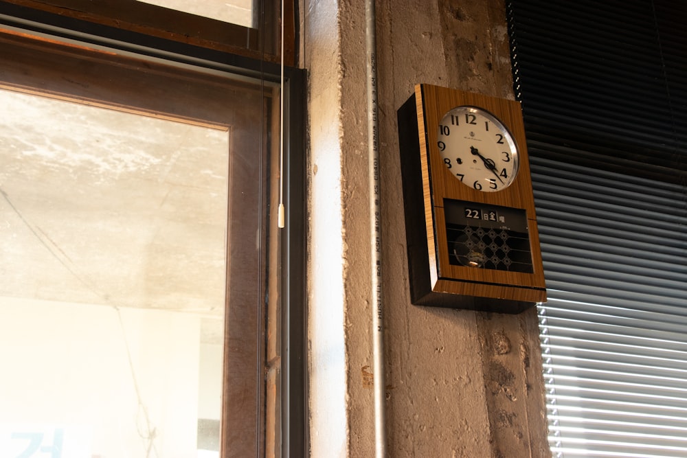 a clock mounted to the side of a wall