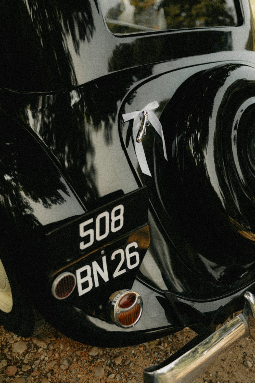 a close up of the front end of a classic car