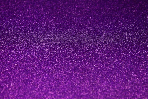 Bright pastel slime with glitter sparkling under light.