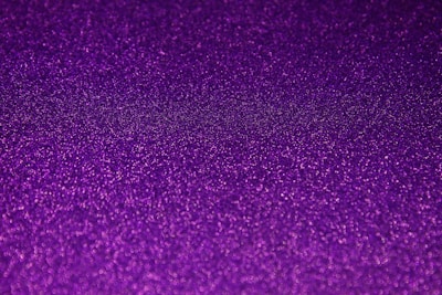 Glossy purple slime with iridescent flakes catching the light.