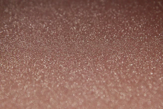 Close-up of shimmering graphene sheets under a microscope.