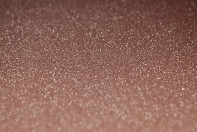 Close-up of a holographic Charizard card shimmering under a bright light.