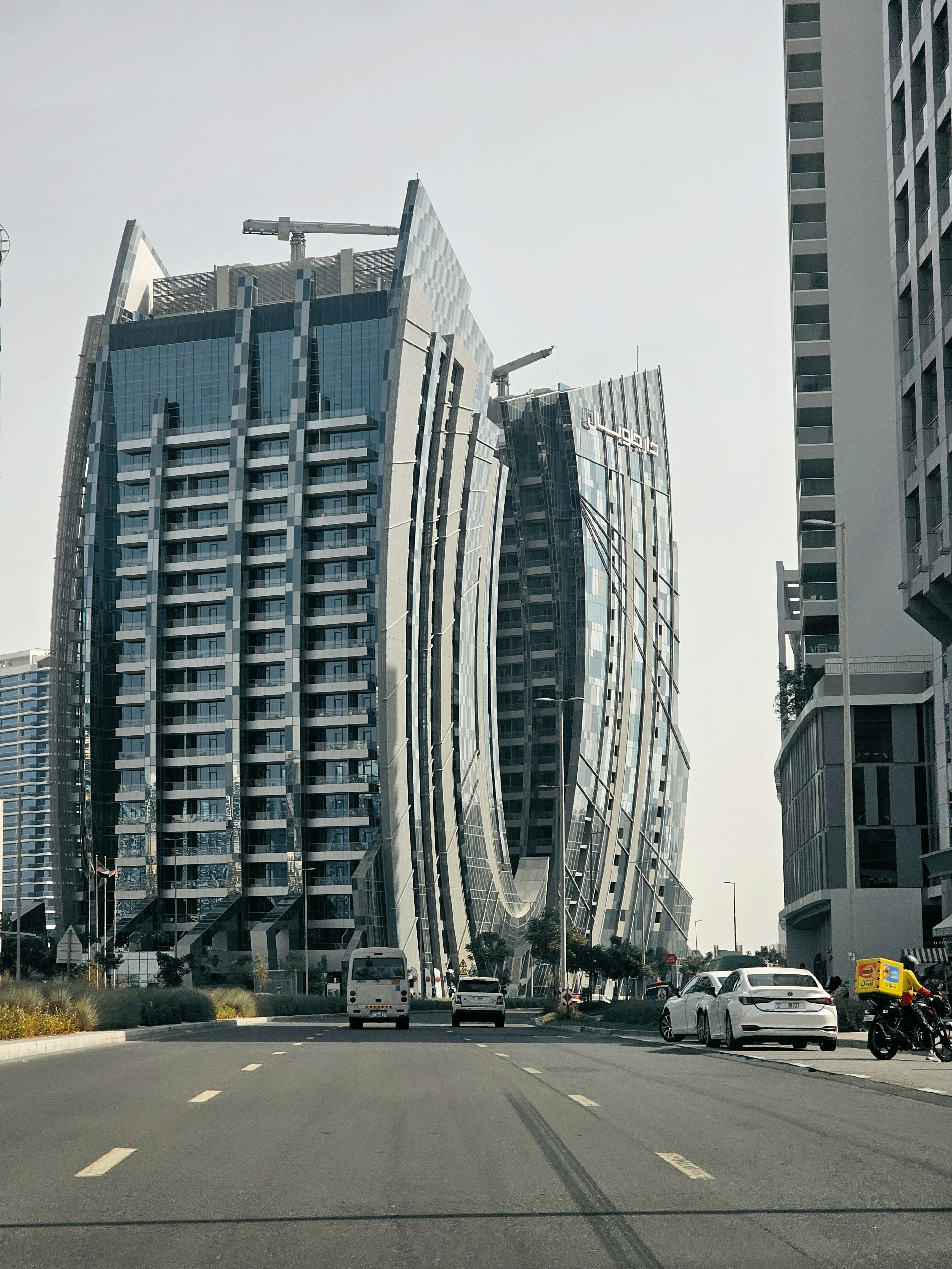 a very tall building sitting on the side of a road