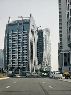 a very tall building sitting on the side of a road