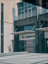 A friendly staff member assisting a customer outside the storage facility near Dubai Silicon Oasis.