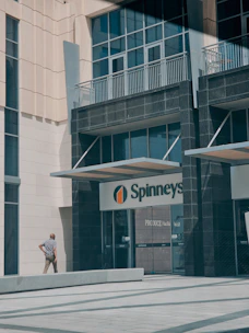 A friendly staff member assisting a customer outside the storage facility near Dubai Silicon Oasis.