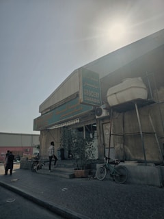 The storefront of Araújo Market with welcoming signage and customers entering.