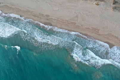 an aerial view of a beach and ocean