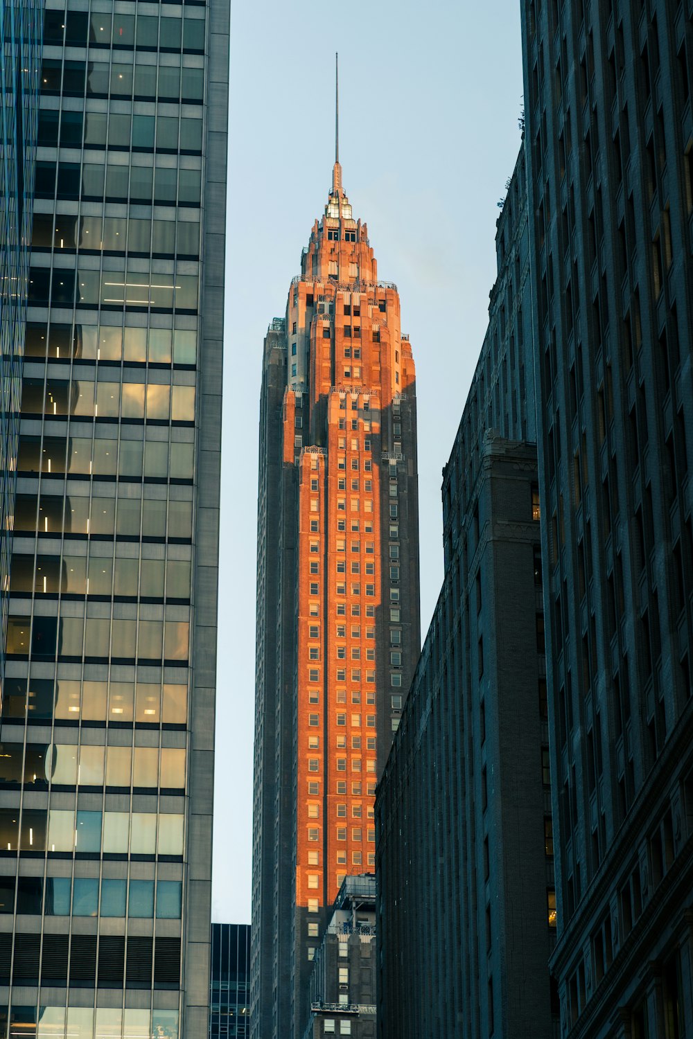 a very tall building towering over a city