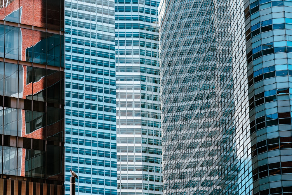 a couple of tall buildings next to each other
