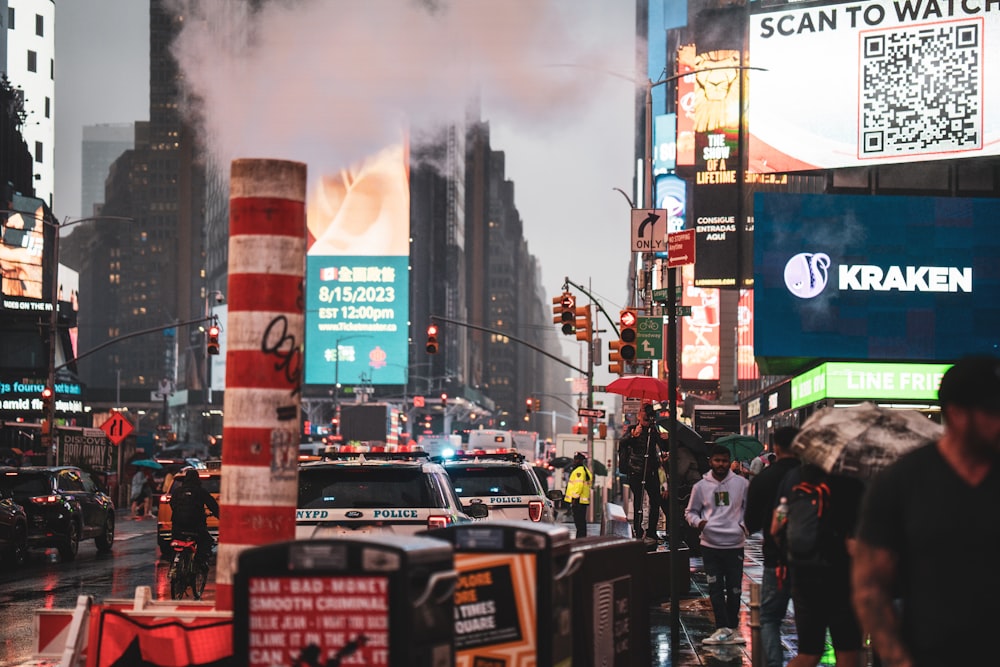 a city street filled with lots of traffic and tall buildings