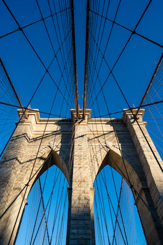 A modern railway bridge symbolizing Franco-Moroccan collaboration under a clear blue sky.