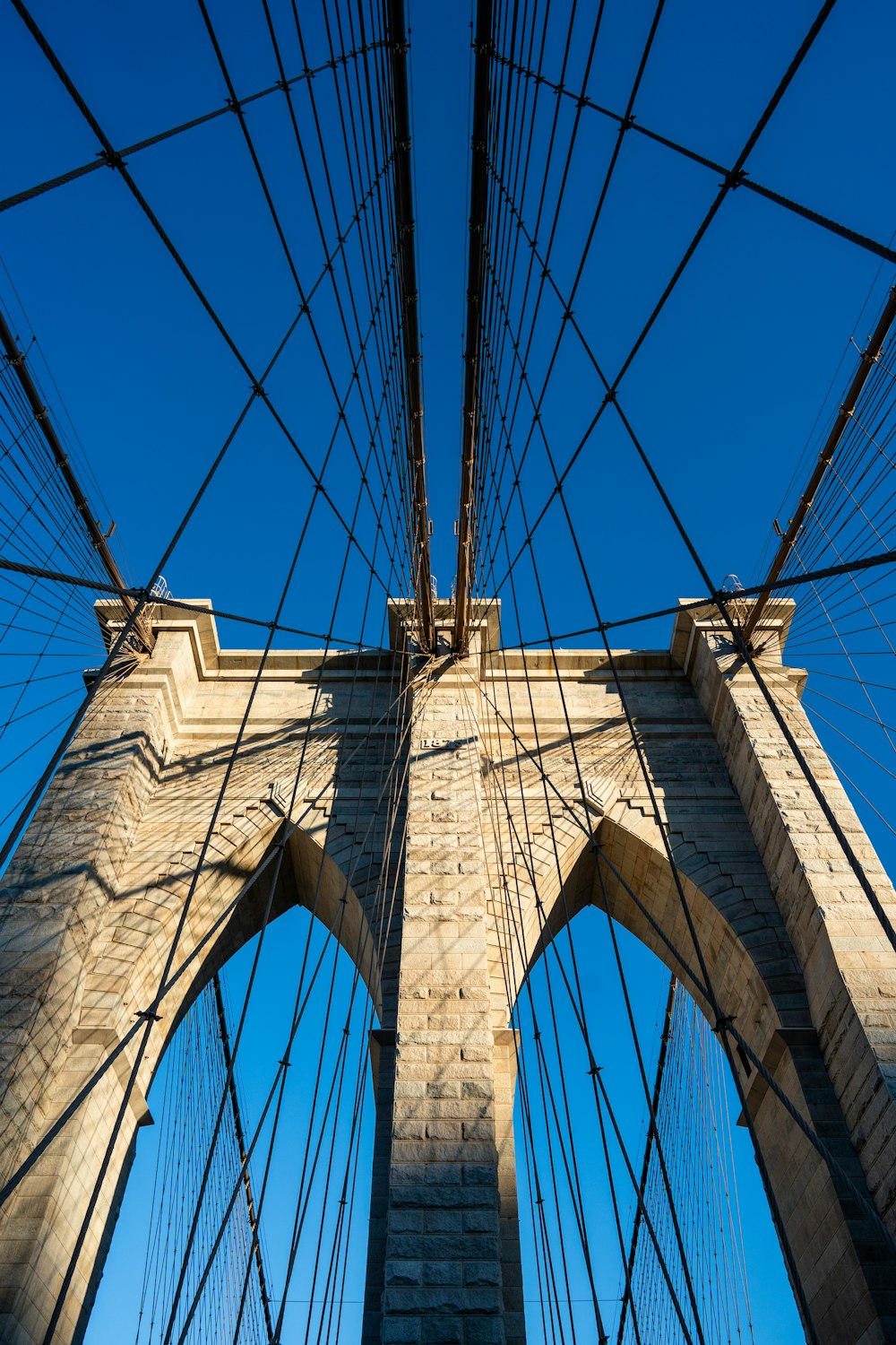 a view of the top of a bridge from below