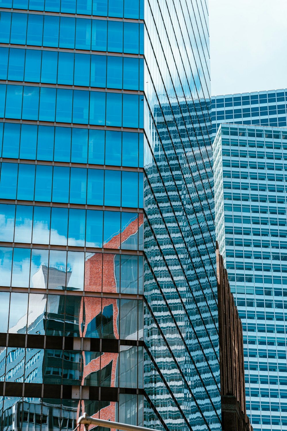 the reflection of a building in the windows of another building