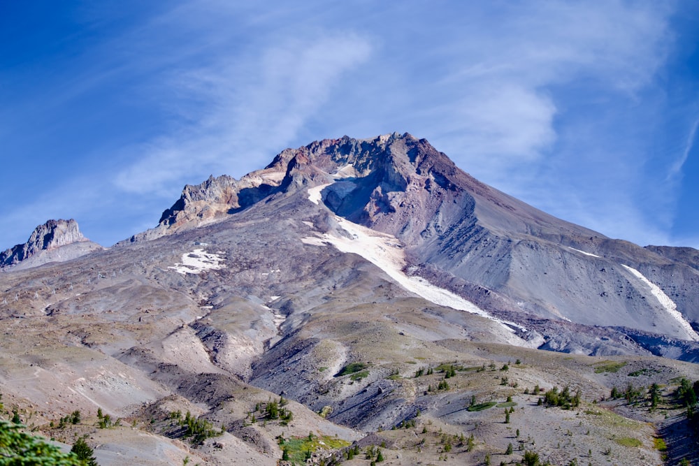 a very tall mountain with a snow covered top