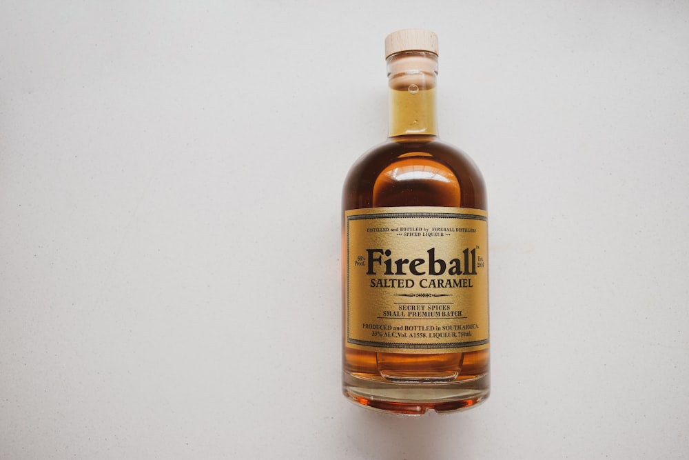 a bottle of fireball whiskey sitting on a table