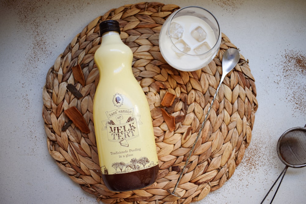 a bottle of milk sitting on top of a basket