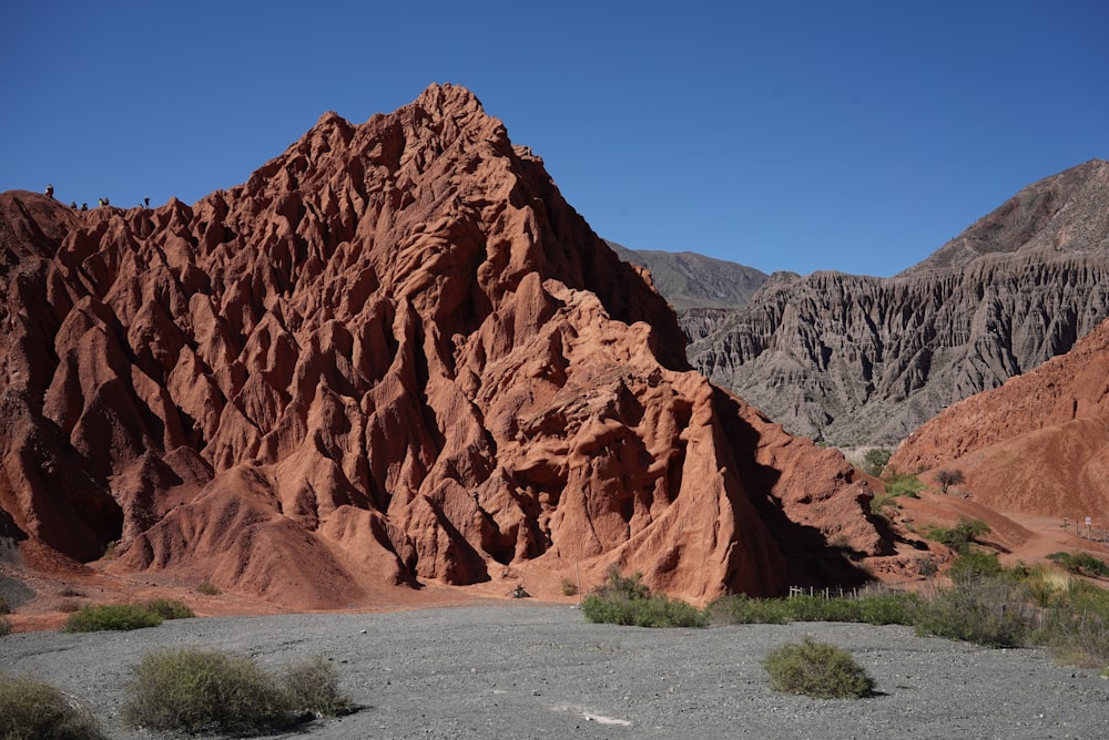 a large rock formation in the middle of a desert