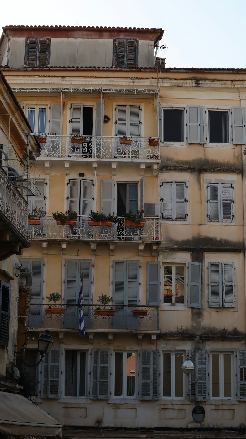 a tall building with many windows and balconies