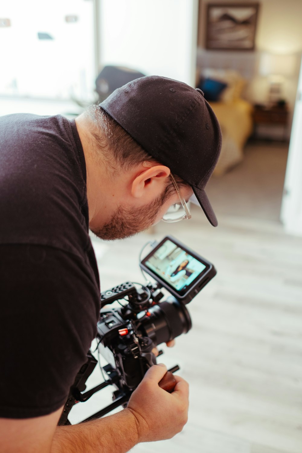 a man holding a camera and a cell phone