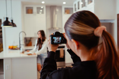 Food creator plating a dish for the camera